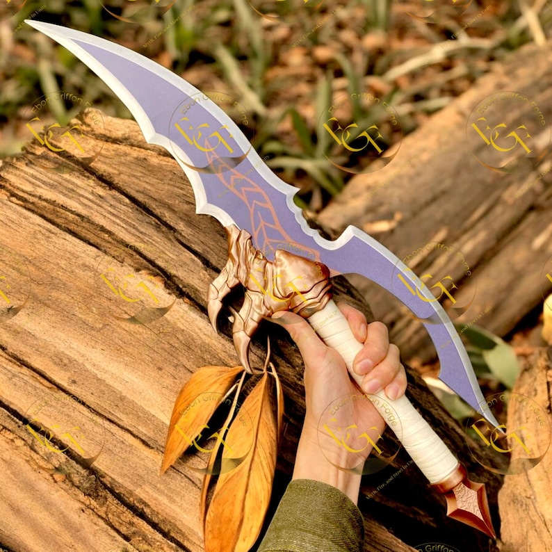 May include: A fantasy sword with a curved, lavender blade featuring a decorative design. The hilt is wrapped in white material and has a gold-colored guard. Two large, brown feathers hang from the hilt. The sword is approximately 24 inches long.