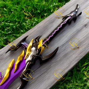 May include: A fantasy sword with a black, gold, and purple color scheme. The blade is purple, and the hilt features intricate gold and black details. The sword has a decorative design, with sharp edges and a pointed tip.