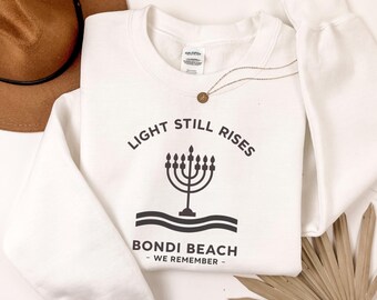 Light Over Darkness Sweatshirt, Bondi Beach Remembers Tribute Custom Gift Graphic Tee, Personalized Gift Memorial RIP 2025 Unisex Sweatshirt