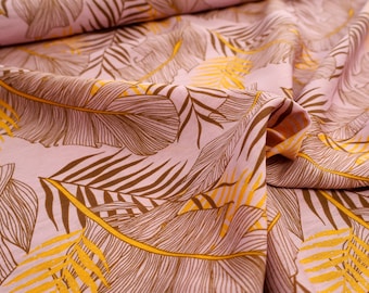 Tejido de viscosa con estampado de hojas en rosa, marrón y amarillo: tejido fluido para vestidos y blusas.