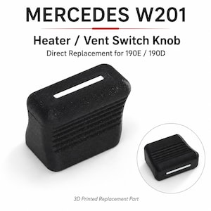 May include: A black 3D printed heater and vent switch knob for a Mercedes W201, 190E, or 190D. The rectangular knob features horizontal ribbed detailing on the sides and a white indicator line on the top surface, shown from two different angles.