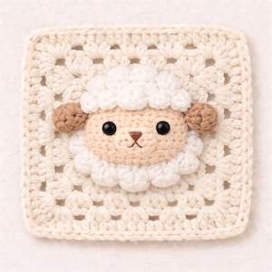 May include: A crocheted square featuring a sheep design. The sheep has a cream-colored face, white fluffy wool, and brown ears. The background is a cream-colored granny square pattern, creating a textured appearance. The sheep's eyes are black.