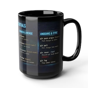 May include: Black ceramic mug with a white interior. The mug features a blue and white design with text about Git commands, including "BRANCH & MERGE" and "UNDOING & SYNC". The mug has a large handle and a glossy finish.