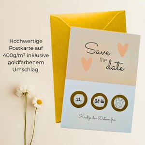 May include: A save-the-date card with a peach and white design, featuring two peach hearts and the words "Save the date." The card includes three scratch-off circles with the date 08-26 and a baby onesie icon. A yellow envelope is behind the card.