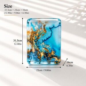 May include: A rectangular tray featuring a marbled blue and white pattern with gold leaf accents. The dimensions are 31.5 cm by 23 cm by 16 cm. The text Size 31.5cm x 23cm x 16cm (12.40in x 9.06in x 6.30in) is visible on the image.