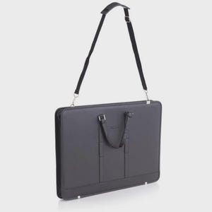May include: A black briefcase with a detachable black shoulder strap. The briefcase has a top handle and a rectangular shape. The bag has silver-colored metal hardware and a small logo on the front.
