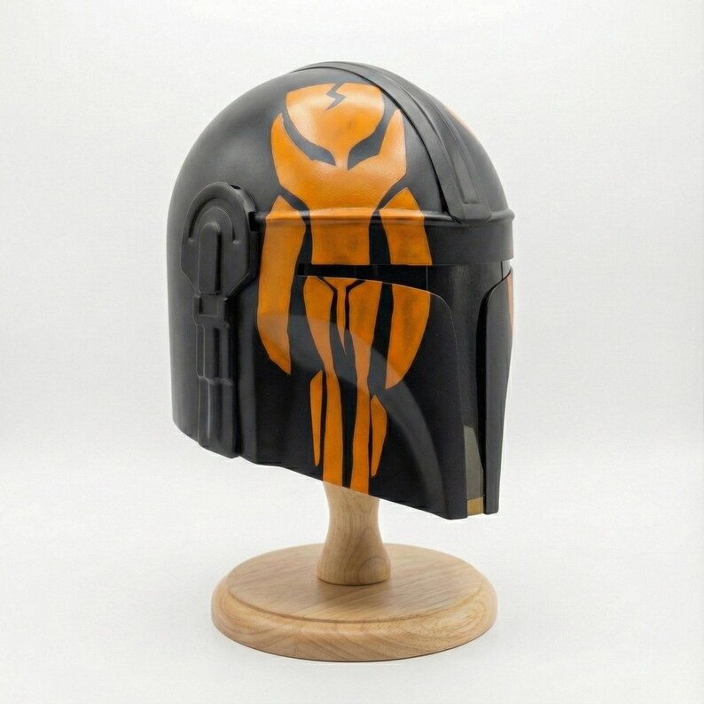 Hand-painted steel Mandalorian helmet in black with a bold red Mythosaur logo; cosplay armor style for fans.