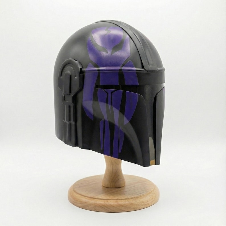Hand-painted steel Mandalorian helmet in black with a bold red Mythosaur logo; cosplay armor style for fans.