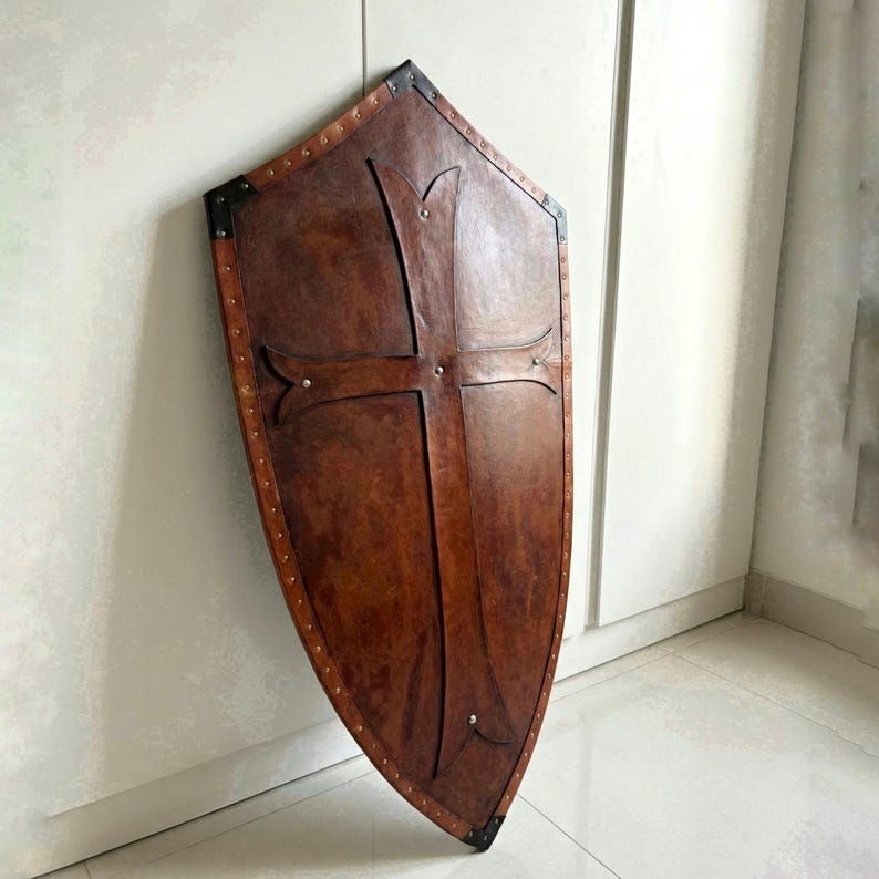 Leather-covered plywood templar shield with cross motif; crusader shield style, riveted edge for wall decor and medieval cosplay.