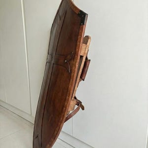 Leather-covered plywood templar shield with cross motif; crusader shield style, riveted edge for wall decor and medieval cosplay.
