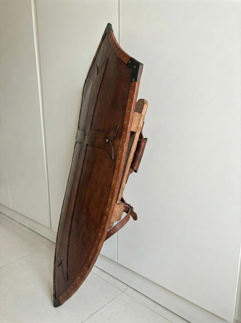 Leather-covered plywood templar shield with cross motif; crusader shield style, riveted edge for wall decor and medieval cosplay.