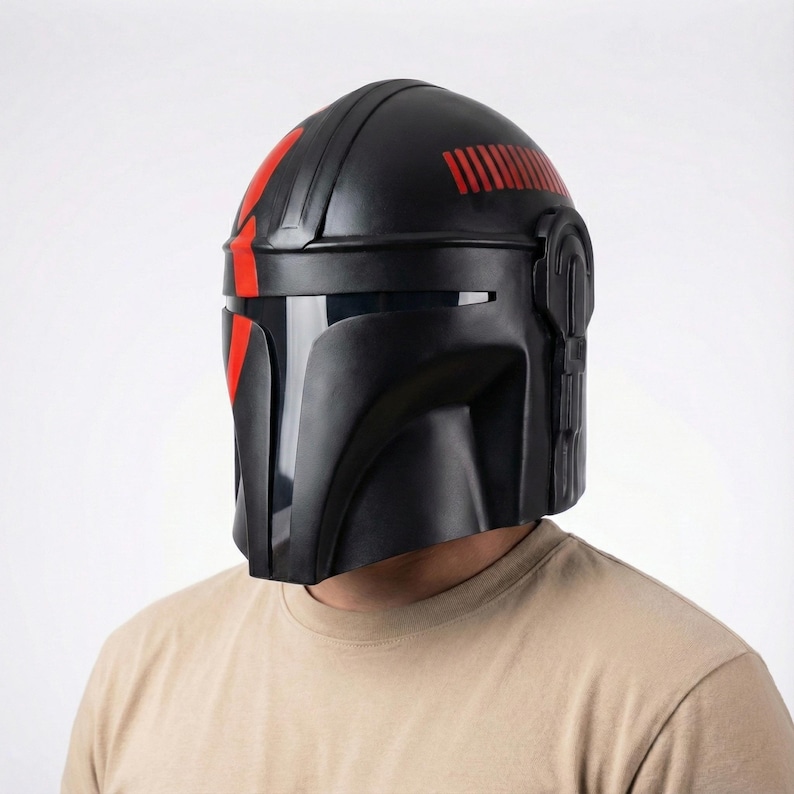Hand-painted steel Mandalorian helmet in black with a bold red Mythosaur logo; cosplay armor style for fans.
