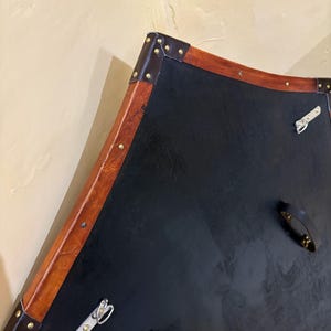 Leather-covered plywood templar shield with cross motif; crusader shield style, riveted edge for wall decor and medieval cosplay.