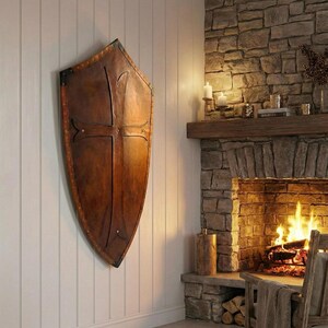 Leather-covered plywood templar shield with cross motif; crusader shield style, riveted edge for wall decor and medieval cosplay.