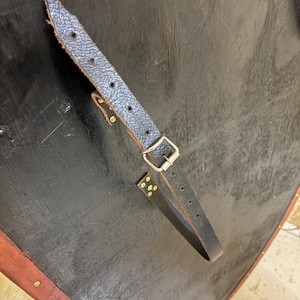 Leather-covered plywood templar shield with cross motif; crusader shield style, riveted edge for wall decor and medieval cosplay.