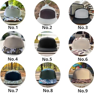 May include: A collection of nine flat-brimmed baseball caps, each with a unique color scheme. The caps feature a variety of designs, including camouflage patterns, solid colors, and contrasting brims. Each cap is labeled with a number from one to nine.