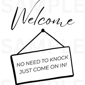 May include: A black and white sign with the word "Welcome" in cursive script above a rectangular sign. The sign reads "NO NEED TO KNOCK JUST COME ON IN!" in a bold, sans-serif font.