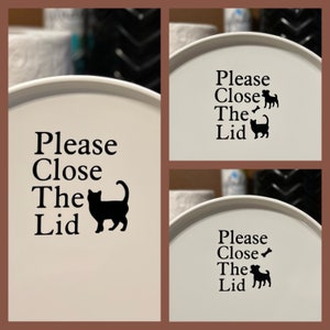 May include: Three white round lids with black text and images that say "Please Close The Lid" with a cat or dog silhouette.