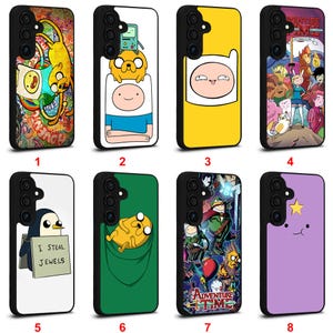 May include: Eight black phone cases featuring Adventure Time characters. Designs include Finn, Jake, BMO, Gunter with a sign reading I STEAL JEWELS, and Lumpy Space Princess. The cases display various colourful scenes and character portraits from the show.