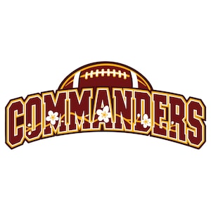 May include: A graphic logo featuring the word COMMANDERS in bold, burgundy, block-style lettering with a yellow outline. Above the text is a stylised football, and white cherry blossom flowers are integrated into the letters of the word.