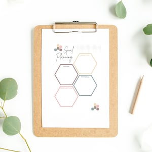 May include: A printable goal planning worksheet with a hexagon design. The worksheet is divided into six sections: spiritual, social, physical, intellectual, career, and financial. Each section has a space for writing goals.