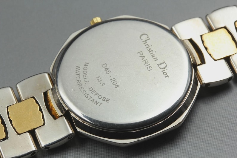 Nahezu neuwertige Vintage Christian Dior D45-204 24mm Damenuhr mit Datumsanzeige und goldenem Zifferblatt, hergestellt in Japan Bild 3