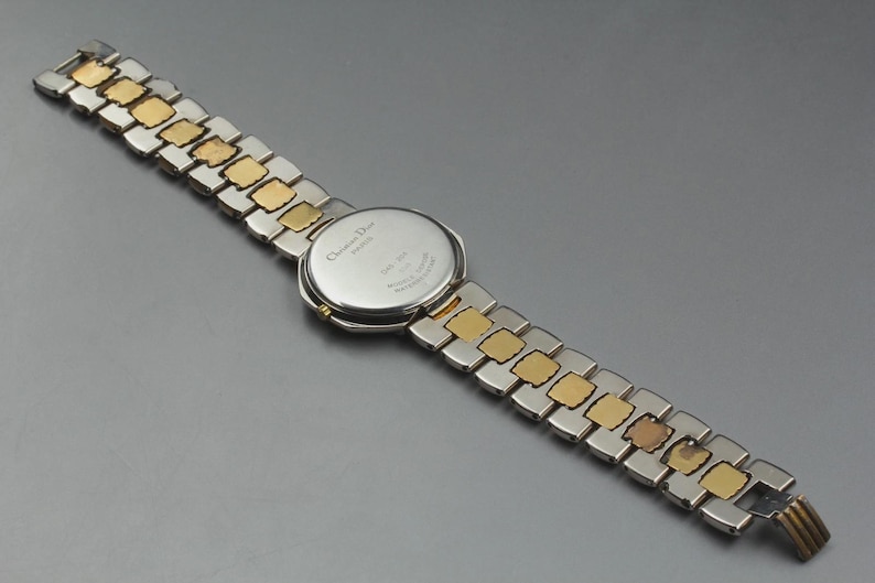 Nahezu neuwertige Vintage Christian Dior D45-204 24mm Damenuhr mit Datumsanzeige und goldenem Zifferblatt, hergestellt in Japan Bild 8