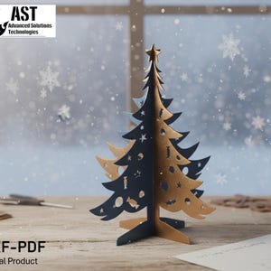 May include: A two-toned, laser-cut Christmas tree with star and cutout shapes. The tree is made of navy blue and tan cardboard and stands on a wooden surface. The image includes the text "DXF-PDF Digital Product".