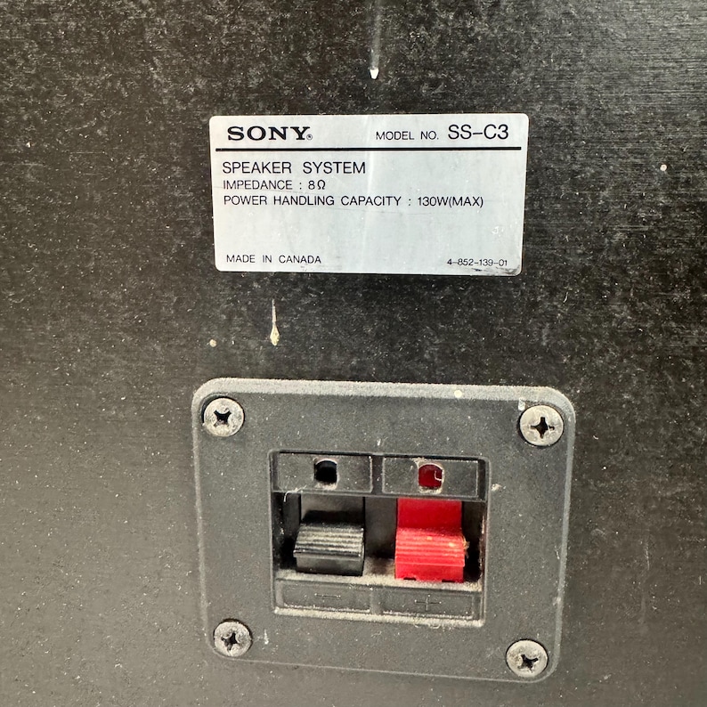 May include: Close-up of a black speaker component with a label that reads "SONY SPEAKER SYSTEM" and "MODEL NO. SS-C3". The label also indicates an impedance of 8&Omega; and a power handling capacity of 130W(MAX).