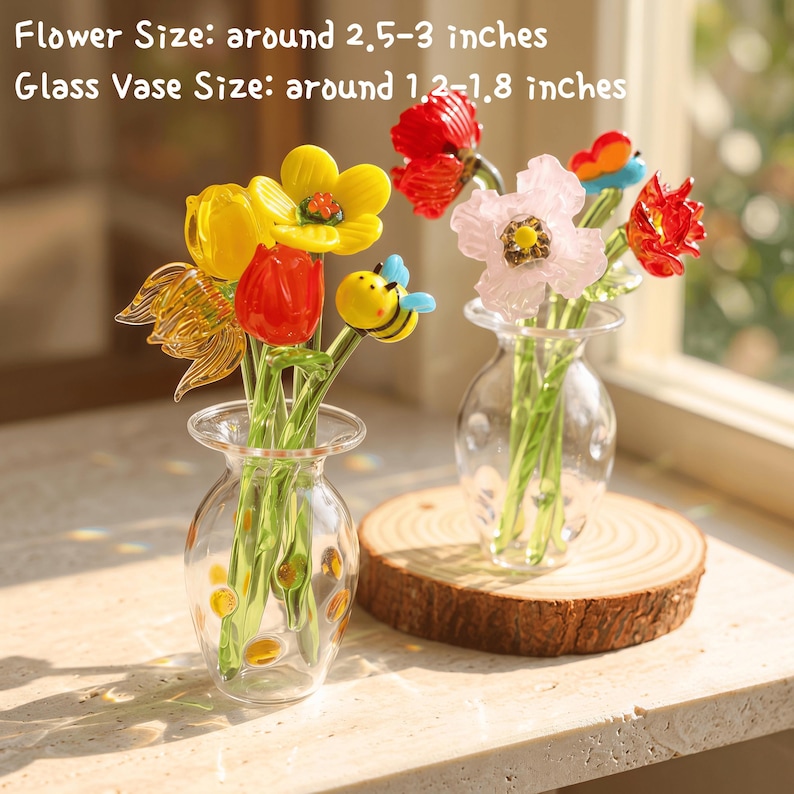 May include: Two glass vases with colorful glass flowers. One vase has yellow, red, and orange flowers, including a bee. The other vase has pink and red flowers. The flower size is around 2.5-3 inches, and the glass vase size is around 1.2-1.8 inches.