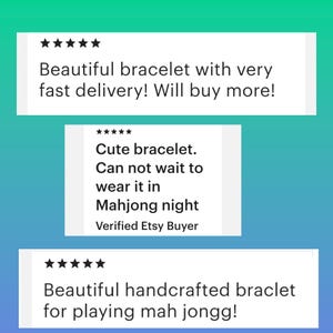 May include: Image of three customer reviews for a bracelet. The reviews are on a teal and blue background. The reviews say "Beautiful bracelet with very fast delivery! Will buy more!", "Cute bracelet. Can not wait to wear it in Mahjong night", and "Beautiful handcrafted braclet for playing mah jongg!"