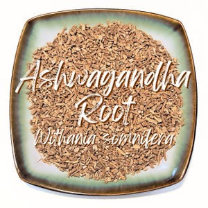 May include: A square plate with a green rim, filled with chopped, brown ashwagandha root. The text "Ashwagandha Root Withania somnifera" is written in white script across the top of the plate.