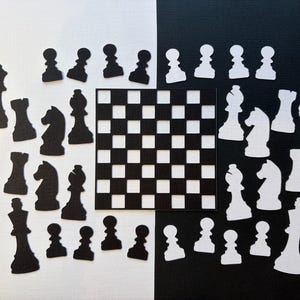 May include: A chess set in black and white, with a chequered board. The chess pieces are arranged against a white and black backdrop. The pieces include pawns, rooks, knights, bishops, a queen, and a king.