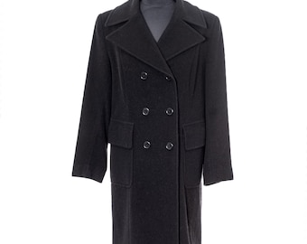 May include: A dark gray double-breasted coat with a notched collar and two rows of buttons. The coat has two front pockets and is displayed on a mannequin. The coat is a classic style, suitable for cold weather.