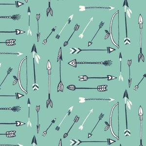 May include: A seamless pattern featuring a variety of hand-drawn arrows in black and white on a light blue background. The arrows are arranged in a repeating pattern, creating a dynamic and modern design.