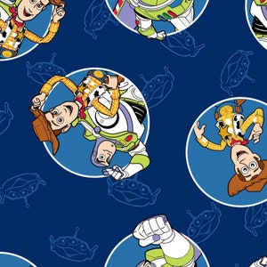 Toy Story - Buzz and Woody Badges Blue from Springs Creative Fabric