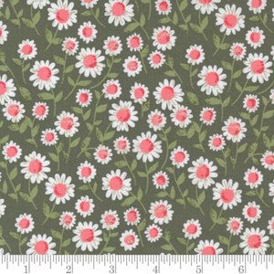 May include: A green fabric with a white and pink floral pattern. The flowers are small and have a simple design.