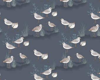 May include: A seamless pattern featuring a repeating design of white sandpipers on a blue background. The birds are depicted in various poses, with some flying, some standing, and some walking. The pattern is perfect for fabric, wallpaper, or other decorative applications.