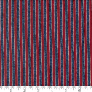 May include: Red and blue striped fabric with a subtle textured pattern. The fabric is shown with a ruler for scale.