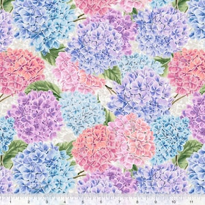 May include: A seamless fabric pattern featuring a variety of hydrangea flowers in shades of blue, pink, and purple. The flowers are arranged in a random pattern on a white background.