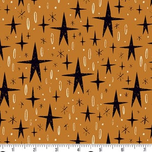 May include: Fabric with a repeating pattern of black stars, white ovals, and small white dots on a golden-brown background. The stars vary in size and shape, creating a retro, mid-century modern aesthetic. The fabric is suitable for various craft projects.