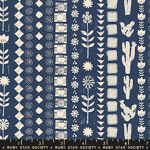 May include: A seamless fabric pattern with a blue background and white geometric designs. The pattern features a variety of shapes, including squares, circles, diamonds, and flowers. The fabric is perfect for quilting, sewing, and crafting.