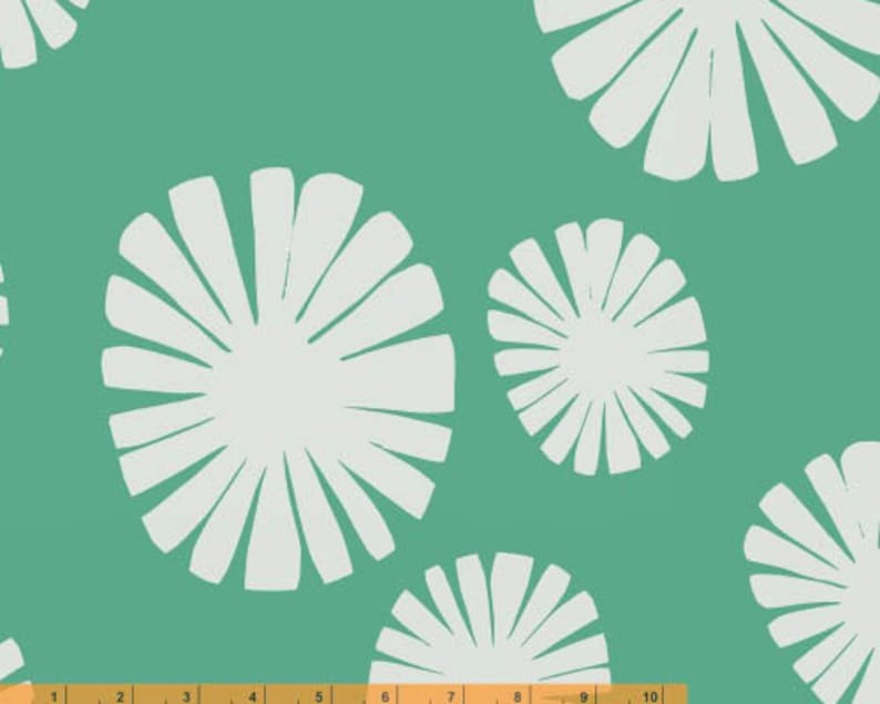 May include: A teal background with a repeating pattern of white stylised flowers. The flowers have a sunburst design.
