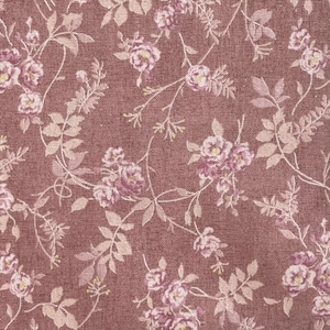 May include: Close-up of a floral fabric featuring a repeating pattern of pink roses and light green leaves on a dark rose background. The fabric has a textured appearance, possibly linen. The design is delicate and romantic, suitable for various textile projects.