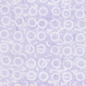 May include: A light purple fabric with a repeating pattern of white circles. The circles are arranged in a grid-like fashion, with some overlapping. The fabric has a textured appearance, with subtle variations in color and tone.