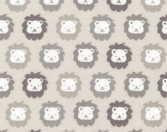 May include: A beige fabric with a repeating pattern of gray lion faces. The lions have white eyes and noses.