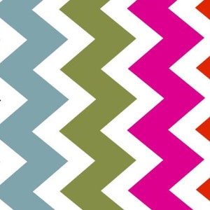 May include: A seamless pattern of black, blue, green, pink, and red zigzags on a white background.