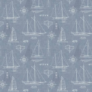 May include: Blue fabric with a repeating pattern of white sailboats, compasses, and nautical blueprints. The design includes the numbers "2-903" and "470", along with the text "42° 17' 6" N". This nautical-themed fabric is suitable for various crafting projects.