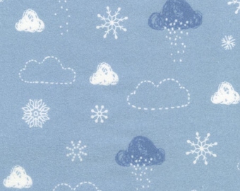 May include: A blue fabric with a white snowflake and cloud pattern. The clouds are outlined in white stitching. Some of the clouds are blue and have white raindrops falling from them.