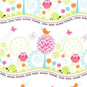 May include: A white background with a repeating pattern of pink owls, butterflies, flowers, and trees. The text "animal friends, little baby animal friends" is repeated throughout the pattern.